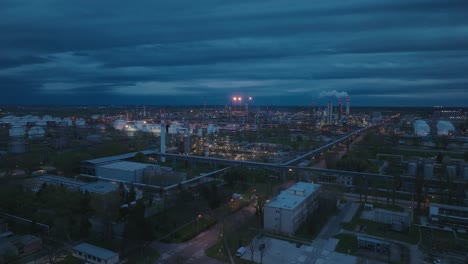 Aerial-Night-view-of-an-industrial-refinery-with-gas-flares-illuminating-the-dark-sky