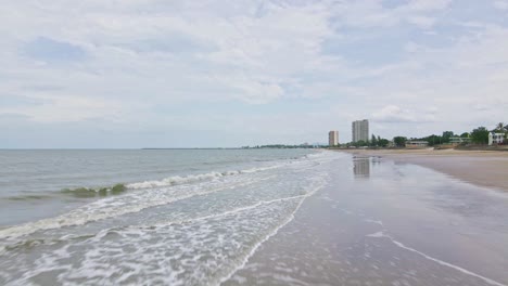 Cha-Am-Beach-with-Low-Flying-Drone-Over-Wet-Sand-in-Thailand