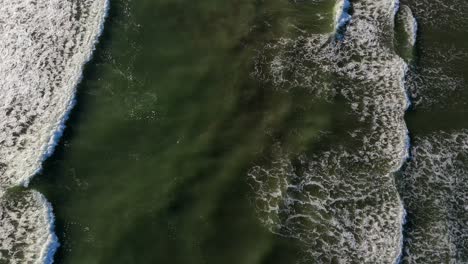 Scenic-aerial-stationary-shot-of-waves-in-the-Pacific-Ocean