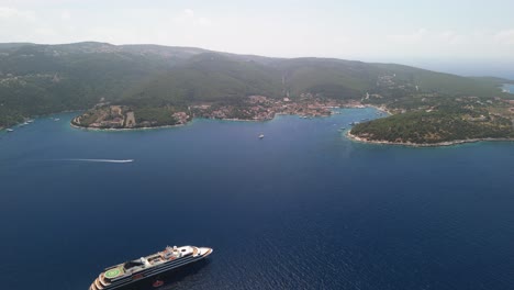 Drone-flying-over-cruise-ship-towards-Kefalonia-island-in-Greece