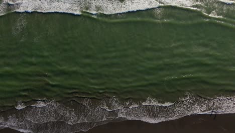 Scenic-aerial-bird's-eye-stationary-shot-of-the-Pacific-Ocean-with-waves-located-in-the-Pacific-Northwest,-Washington-State