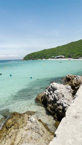 beach-has-crystal-clear-water-and-boats-are-also-there