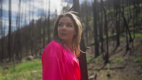 Calm-female-in-pink-walking-through-trees