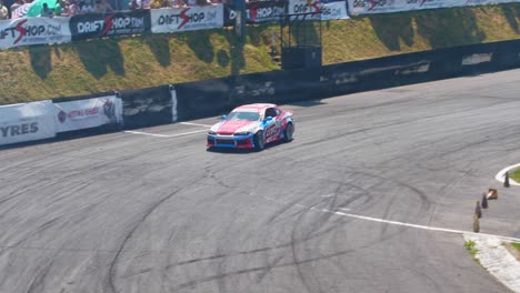 Race-car-leaving-the-racing-tracks-through-the-smoke