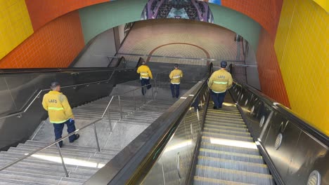 Firefighters-walk-down-stairs-to-train-platform