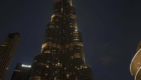 Lights-twinkle-and-flash-tilting-up-Burj-Khalifa-skyscraper-at-dusk