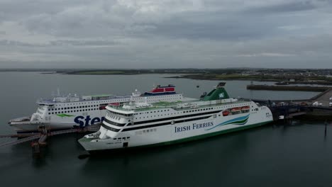 Irish-Ferries-and-Stenaline-docked-passenger-ships-aerial-view-approaching-Holyhead-harbour-gateway