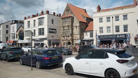 footage-of-Scarborough-South-Bay-with-people-cars-and-tourists,-North-Yorkshire-on-a-summer-day-on-a-busy-weekend-with-families-enjoying-the-English-coastal-seaside-resort