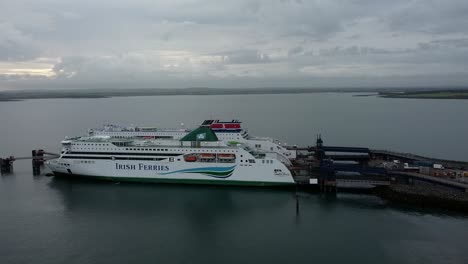 Irish-Ferries-and-Stenaline-docked-passenger-ships-aerial-view-orbiting-Holyhead-harbour-gateway