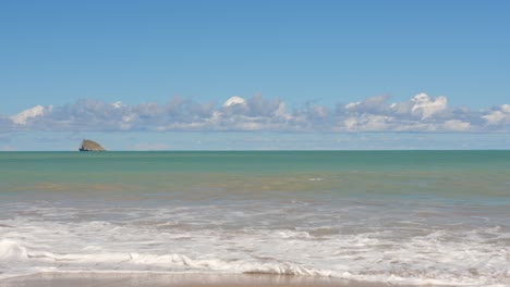 Relaxing-view-of-ocean-waves-on-beach-on-sunny-day