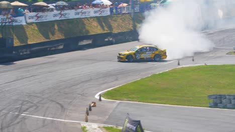 Golden-race-car-drifting-on-a-very-tight-curve-with-lots-of-smoke