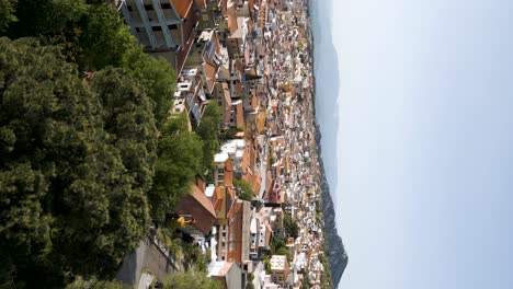 Vertical-Aerial-Shot-Of-Dorgali,-A-Village-Town-In-Sardinia