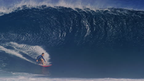 Tracking-follows-surfer-gliding-effortless-at-base-of-heavy-wave-pulling-into-deep-barrel,-Cloudbreak-Fiji