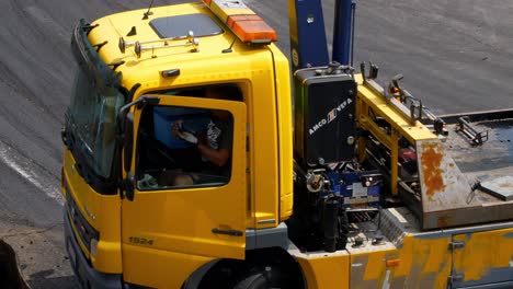 Tow-truck-leaving-the-racing-tracks-with-the-crashed-car