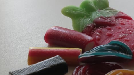 Horizontally-and-close-up-movement-of-mixed-jellies-on-a-table-in-studio-environment-at-home