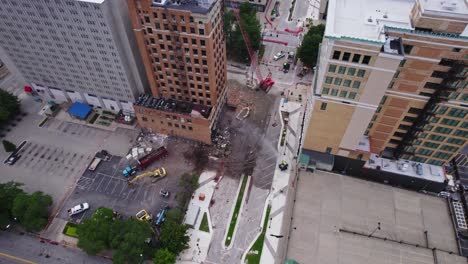 An-aerial-capturing-the-demolition-of-a-high-rise-building-in-downtown-Youngstown,-Ohio