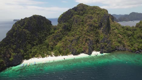 4K-drone-video-of-Entalula-Island,-a-stunning-tropical-island-near-El-Nido-in-Palawan,-Philippines