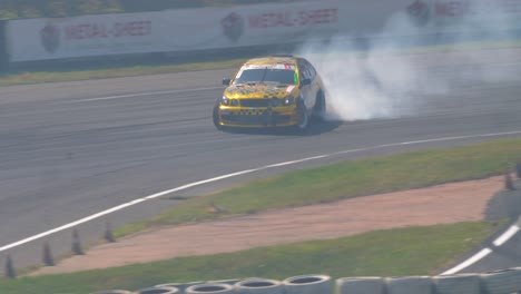 Golden-race-car-drifting-and-burning-tires-with-lots-of-smoke