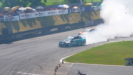 Two-race-cars-drifting-on-a-very-tight-curve-drifting-with-lots-of-smoke