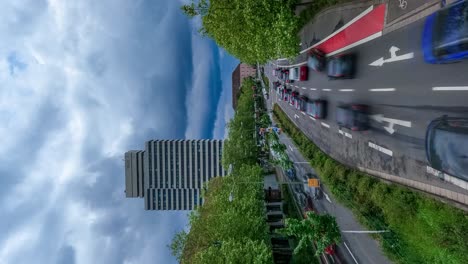 VERTICAL,-Motion-Time-lapse-of-Stop-And-Go-Street-Traffic-in-City-Center,-Wide-High-Angle