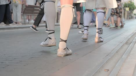 Street-view-of-people’s-lower-legs-dancing-a-typical-ball-with-black-espadrilles,-a-traditional-Spanish-and-Valencian-footwear