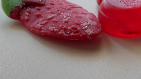 Diagonal-movement-of-big-strawberry-and-red-bear-gummy