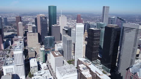 Drone-Shot,-Downtown-Houston,-Texas-USA,-Financial-District-Towers-and-Skyscrapers-on-Hot-Sunny-Day