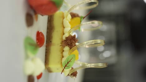 Vertical-View-Of-A-Fancy-Sweet-Cheesecake-In-A-Luxury-Restaurant