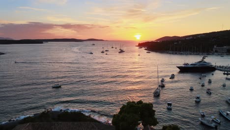 Aerial-drone-shot-of-a-church-near-the-coast-of-Hvar-old-town-at-sunset