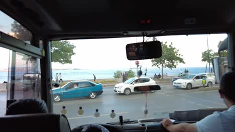 Front-view-from-a-tourist-bus-moving-along-the-coastal-area-of-Istanbul,-Turkey,-capturing-the-scenic-beauty-and-vibrant-atmosphere-of-the-city