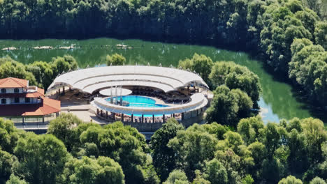 Aerial-view-in-front-of-the-pool-at-the-Plavnica-Eco-Resort,-in-sunny-Montenegro