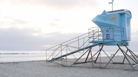 A-border-patrol-lookout-tower-stands-alone-on-a-tranquil-beach-at-dawn,-embodying-the-quiet-yet-constant-vigilance-required-to-secure-the-coastal-boundaries-of-the-Mexico-U