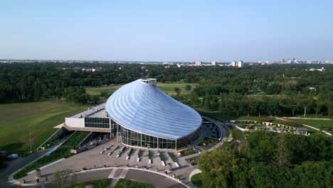 Cinematic-Drone-Orbit-of-The-Leaf-Conservatory-at-Sunset-in-Winnipeg-Park