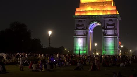 Crowd-of-tourists-at-popular-landmark-Indian-Gate-at-night