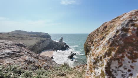 Witness-the-stunning-coastal-cliffs-of-Crimea,-overlooking-the-serene-waters-of-the-Sea-of-Azov-on-a-clear-day,-capturing-the-beauty-of-this-unique-landscape