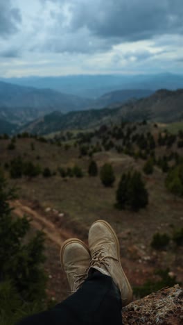 Young-hiker-walking-in-forest,-Young-man-walking-in-forest,-Footage-of-a-young-man-hiking-and-walking-through-a-scenic,-forested-mountain-terrain,-Hiking