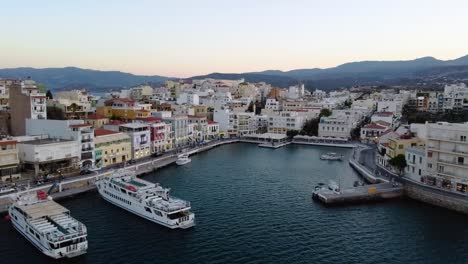 Revealing-Aerial-of-Agios-Nikolaos-Town-Marina,-Crete,-Greece