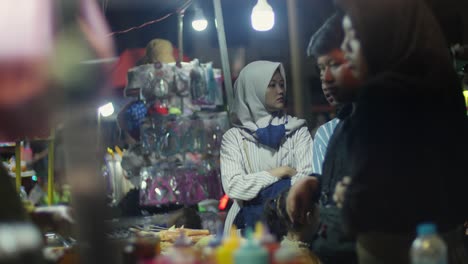 Young-Indonesian-Muslim-woman-shopping-at-local-market-near-Taman-Fatahillah-in-Jakarta