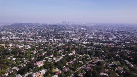 Stunning-aerial-footage-showcasing-the-extensive-residential-areas-of-Los-Angeles,-highlighting-the-diverse-and-sprawling-neighborhoods-that-stretch-out-towards-the-city-skyline