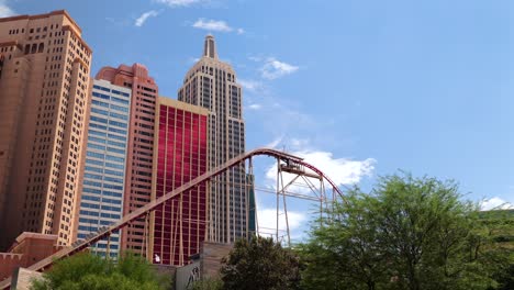 Persons-POV-looking-up-at-New-York-Hotel-in-Las-Vegas-as-a-roller-coaster-begins-to-climb-with-passengers-on-the-ride