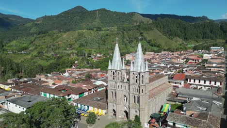 Basilica-steeple-towers-dominate-beautiful-mountain-town,-Jardin-COL