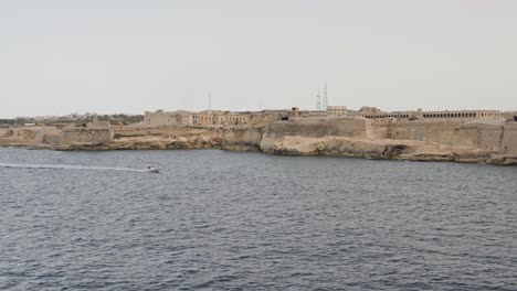 Cruise-ship-departing-Malta-at-sunset