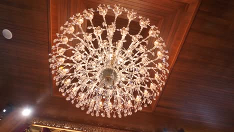 Beautiful-Antique-Crystal-Chandelier-under-Wood-Ceiling