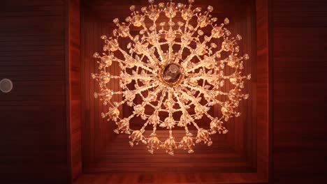 Beautiful-Antique-Crystal-Chandelier-under-Wood-Ceiling