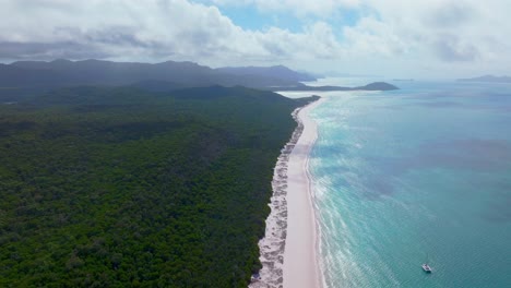 Sunny-blue-sky-sail-boat-yacht-Whitehaven-Beach-stunning-white-sand-aerial-drone-Hill-Inlet-Lookout-Whitsundays-Islands-Australia-outer-Great-Barrier-Reef-clear-blue-aqua-ocean-water-up-forward-motion