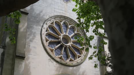 Slow-establishing-shot-of-a-geometrical-stained-glass-window-on-a-building