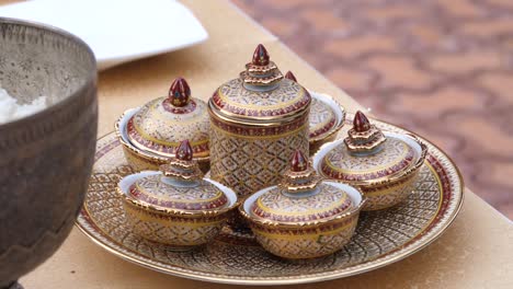 Benjarong-Ceramic-Bowls-with-Food-and-Dessert-inside,-Close-Up