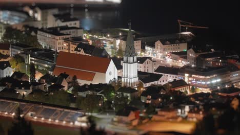 Beautiful-nighttime-scene-of-the-Molde-coastal-town,-showcasing-illuminated-streets-and-harbor