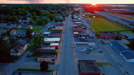 Drone-tilt-down-shot-of-residential-area-in-the-city-of-Davenport,-Iowa-during-sunset-sky,-USA