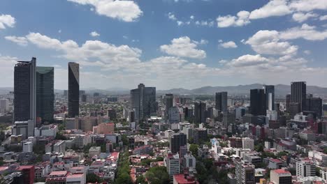 Panoramic-daytime-aerial-of-Reforma-Avenue,-the-economic-hub-of-Mexico-City,-Mexico